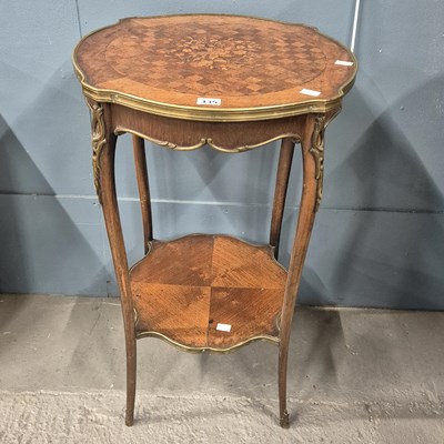 Lot 335 - A French marquetried kingwood two tier table,...