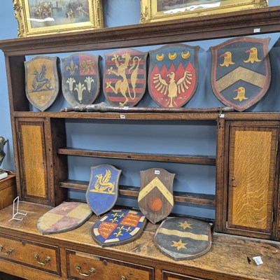Lot 336 - Ten painted wooden armorial shields.   H 43cms.