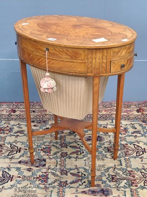 Lot 339 - A late 19th century satinwood work table, the...