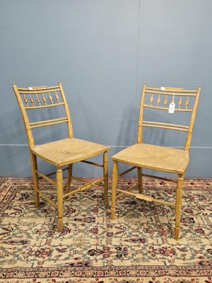 Lot 341 - A pair of Regency olive painted chairs...