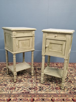 Lot 344 - A pair of green painted white marble topped...