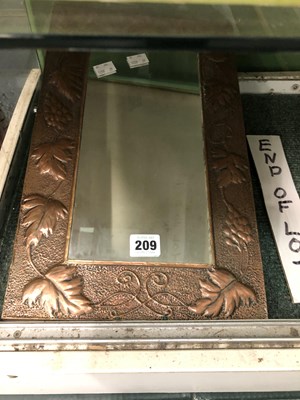 Lot 209 - An Arts and Crafts copper grape vine moulded...