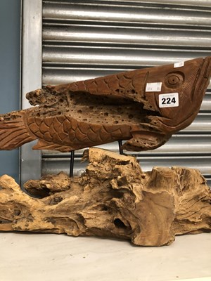 Lot 224 - A drift wood carving of a fish mounted on a...