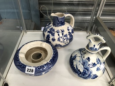 Lot 228 - A willow pattern ewer and nightlight holder...