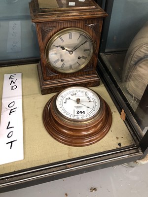 Lot 244 - An oak cased mantle clock striking on a coiled...