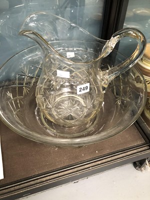 Lot 249 - A cut clear glass wash jug and bowl