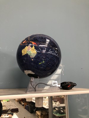 Lot 281 - An electrically lit terrestrial globe on a...