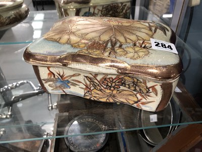 Lot 284 - A pair of Satsuma type porcelain covered boxes