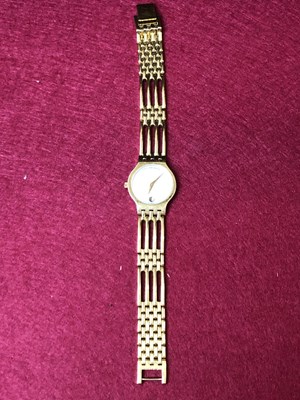 Lot 113 - A lady's Movado Esperanza gold-plated quartz...