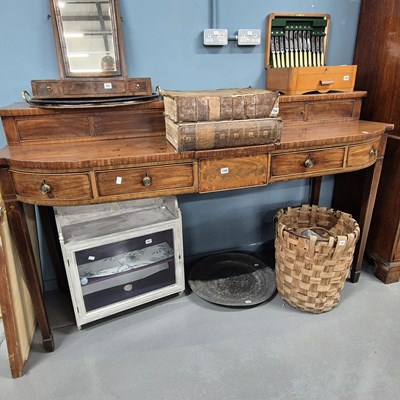 Lot 748 - An early 19th-century tall bow-front server...