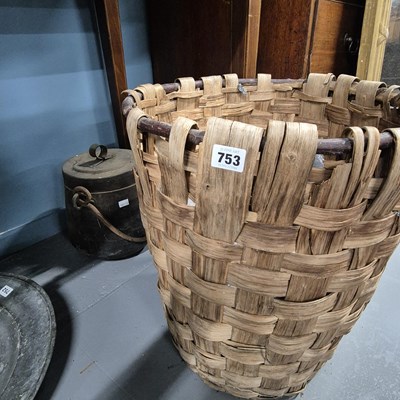 Lot 753 - Two copper pans and a basket.