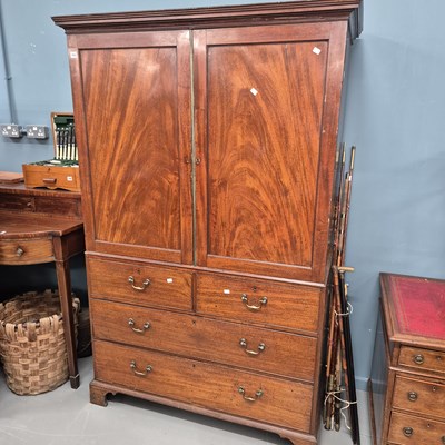 Lot 755 - An early 19th-century mahogany linen press...