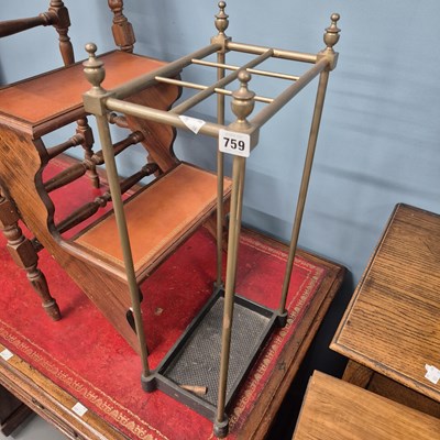 Lot 759 - A brass and iron stick stand. H 65 W 30 D 20cms
