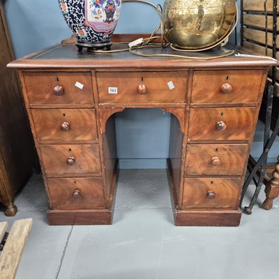 Lot 763 - An early 19th-century mahogany knee-hole desk.