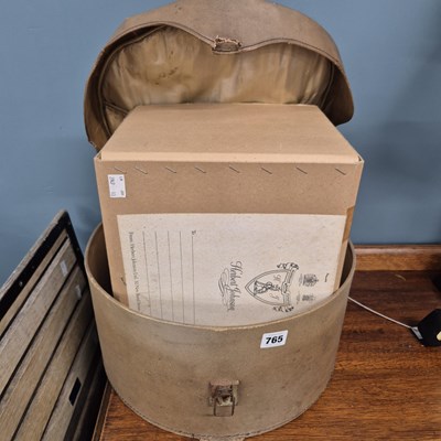 Lot 765 - A boxed grey top hat and a further hat box.