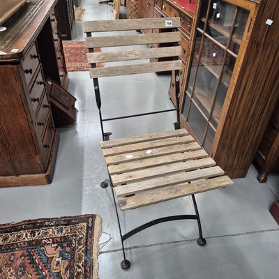 Lot 769 - A pair of folding chairs.