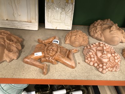 Lot 336 - Six terracotta wall masks, a Della Robbia...