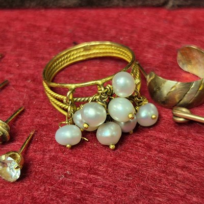 Lot 132 - Gold - Unhallmarked multi pearl drop ring...