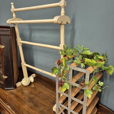 Lot 777 - A wine rack and a towel rail