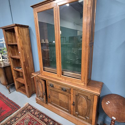 Lot 781 - An oak sideboard with an associated glazed...