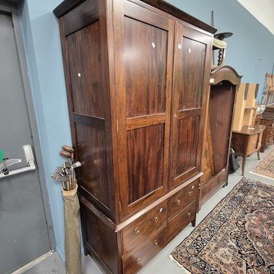 Lot 788 - A modern hardwood wardrobe with a four-drawer...