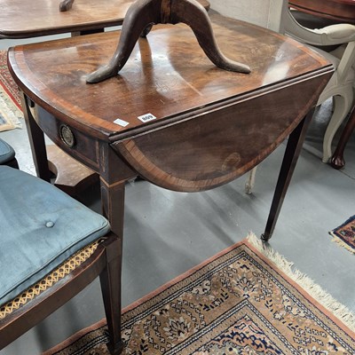 Lot 809 - A George III mahogany drop-leaf oval Pembroke...