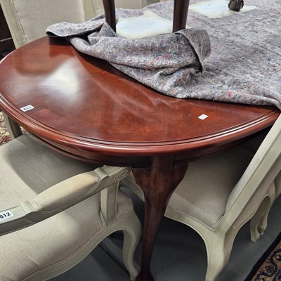 Lot 811 - A modern mahogany dining table and eight...