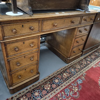Lot 826 - A Victorian oak twin pedestal desk. H 73 W 115...