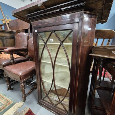 Lot 833 - A Georgian glazed corner cabinet.