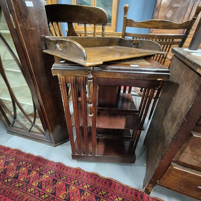 Lot 834 - A Revolving bookcase and a bed tray