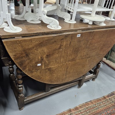 Lot 857 - An 18th-century large oak drop-leaf table. H...