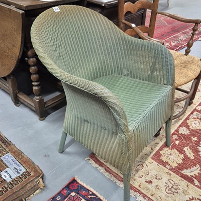 Lot 858 - A lloyd loom armchair