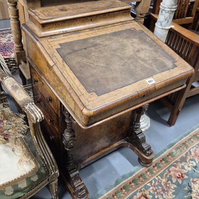 Lot 861 - A Victorian walnut davenport desk