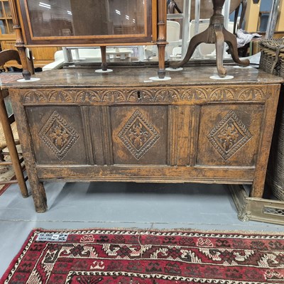 Lot 874 - A georgian carved oak coffer with three panel...
