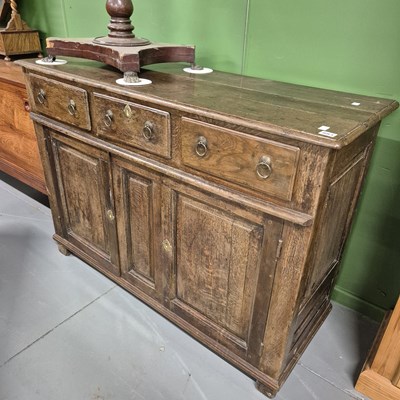 Lot 883 - An 18th century oak dresser base with three...