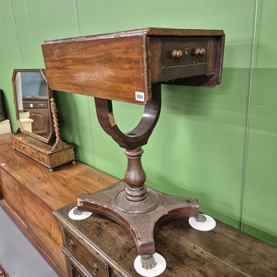 Lot 884 - A late Georgian mahogany work table.