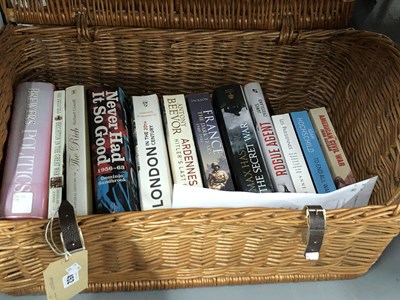 Lot 452 - A picnic basket containing novels and other books