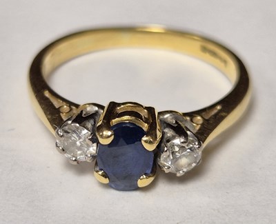 Lot 138 - An 18ct hallmarked gold sapphire and diamond...