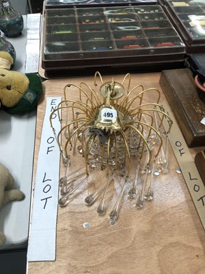 Lot 495 - A brass ceiling light hung with tea shaped...