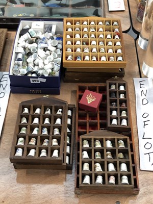Lot 499 - Wooden wall racks of porcelain thimbles...