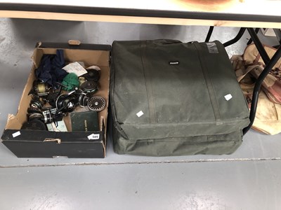 Lot 505 - A collection of fishing reels, two fishing...