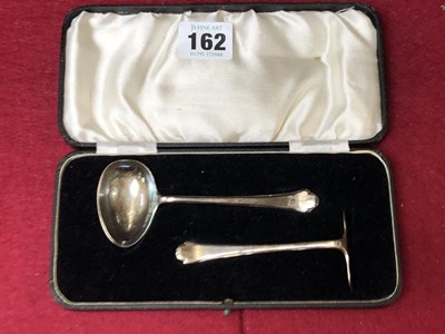 Lot 162 - A hallmarked silver spoon and pusher cased set.