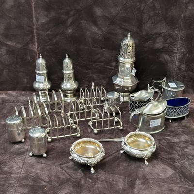 Lot 166 - Hallmarked silver to include six toast racks,...