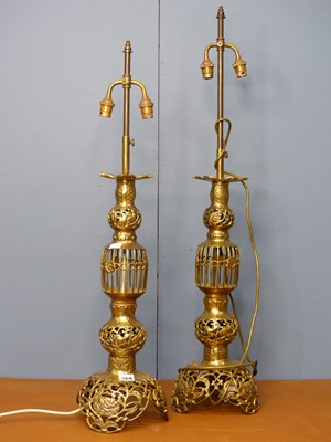 Lot 368 - A pair of Oriental gilt metal two socket table...