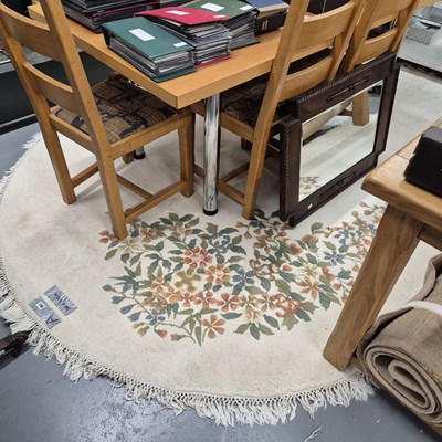 Lot 961 - An indian oval carpet of chinese design