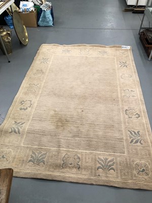 Lot 969 - A machine made rug of Tibetan design