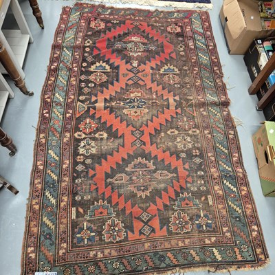 Lot 973 - An antique Caucasian tribal rug