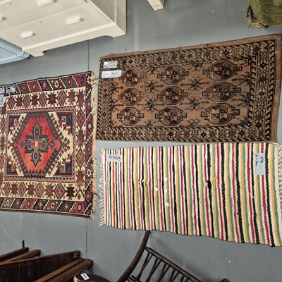 Lot 974 - A Turkoman bag face and a small tribal rug