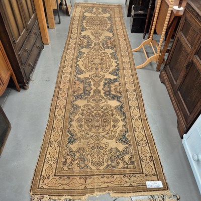 Lot 975 - An antique Persian tribal runner 385 x 104cms