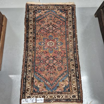 Lot 982 - An antique Persian Hamadan rug 132 x 70cms